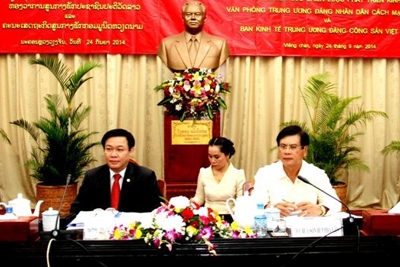 Việt Nam – Lào trao đổi kinh nghiệm về tình hình kinh tế Việt Nam và thế giới 